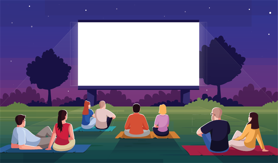 Peopple sitting in the grass looking at an outdoor movie screen at dusk.png